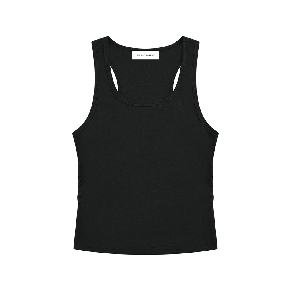 A black racerback tank top with a small white brand label at the inner collar, displayed flat against a solid white background.
